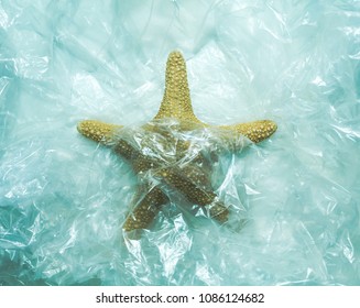 Starfish Aquatic Animal Trapped In Plastic,concept Ocean Waste Contamination Pollution Water Toxic Residues In The Sea.Save The Planet,save The Ocean,