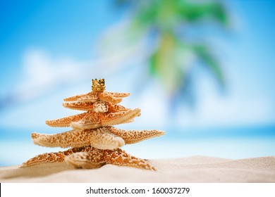 Starfish Christmas Tree On Beach With Seascape Background