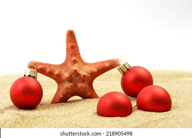 Starfish With Red Christmas On Sandy Beach - Concept Of A Warm Weather Christmas