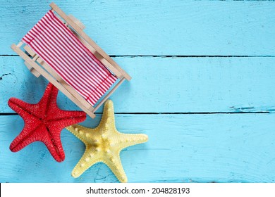 Starfishes And Armchair On Blue Wooden Background