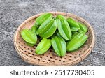 Starfruit, Belimbing (Averrhoa carambola) is a species of tree in the Oxalidaceae family native to tropical Southeast Asia. Starfruit (Averrhoa carambola) on basket.