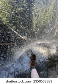 staring down from behind a 
waterfall