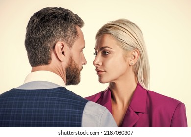 staring at each other. businesspeople. businessman and girl. contradiction and confrontation.