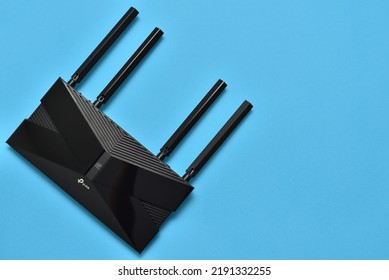 Stariy Oskol, Russia - January 28, 2021: Modern WiFi Router Tp-link With Intel Chip Inside On Blue Background