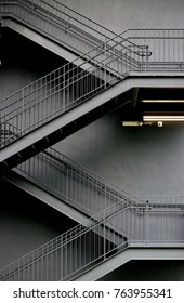 Stark Lines Of A Modern Metal Industrial Staircase On The Exterior Of A Factory In Singapore