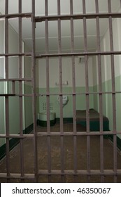 Stark Prison Cell With Bed And Toilet