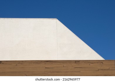 Stark white wall with deep blue sky background wooden edge