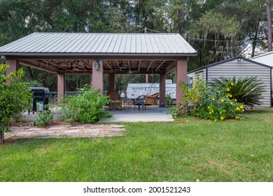 Starke, Florida USA - July 3, 2021: Front of a brick home with a carport now used as a covered patio