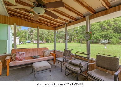 Starke, Florida USA - June 25, 2022: Screened in patio overlooking a large backyard