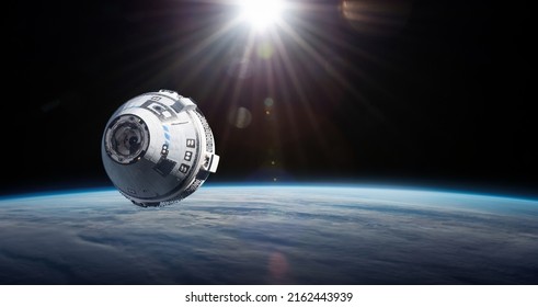 Starliner spaceship in space. Crew Space Transportation on orbit of Earth. Expedition to International space station. Elements of this image furnished by NASA