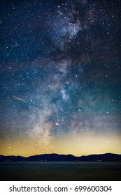 Starry Night And Milky Way Above The Sierra Nevada Mountains And Lake Tahoe, California