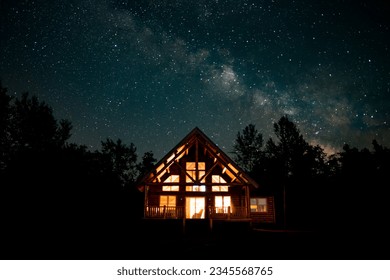 Starry night with Milky Way over a cabin in the woods of northern Michigan