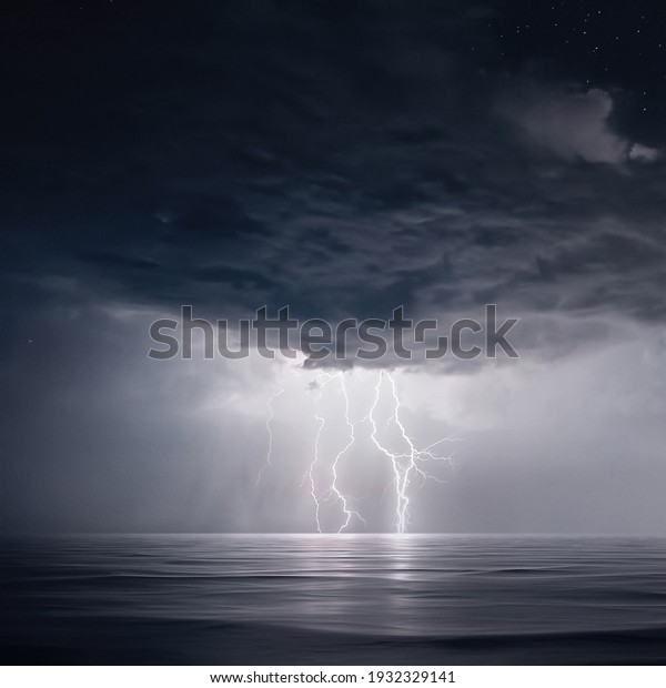 Starry night with Thunderstorm. Night\
thunderstorm with lightning above the\
sea