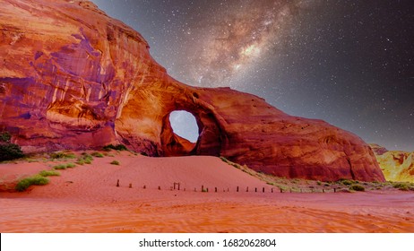 Starry Sky behind the Ear of The Wind, a hole in a rock formation in Monument Valley Navajo Tribal Park on the border of Utah and Arizona, United States - Powered by Shutterstock