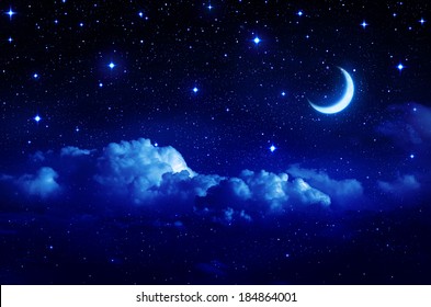 starry sky with half moon in scenic cloudscape 