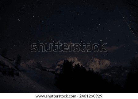 Starry sky, trees and snow, Lienz Austria, beautiful Shootingstar, 