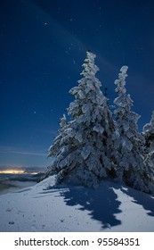 Starry Winter Night On The Peak Of A Mountain