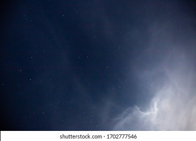 Stars And Clouds In Desert With FullMoon