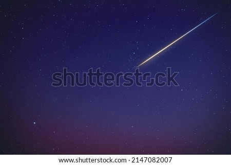 Stars, meteor trail on evening sky.