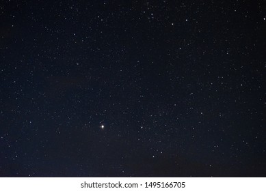 Stars In The Night Sky Through The Clouds