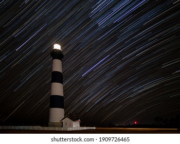 Stars Streak Across The Night Sky In Front Of The Bodie Island Lighthouse In The Outer Banks Of North Carolina, Nag's Head