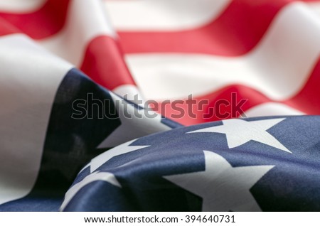 Stars and Stripes Flag background; rippling red white and blue silken American flag
