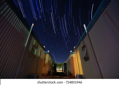 Stars Trails Between Two Building At West Angelas Mining Site, Perth Of Australia  