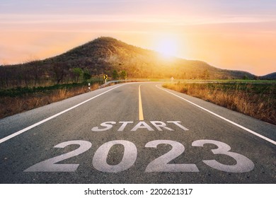 Start 2023 written on highway road in the middle of empty asphalt road of asphalt road at sunset.Concept of planning and challenge, business strategy, opportunity ,hope, new life change.for 2022-2023. - Shutterstock ID 2202621317