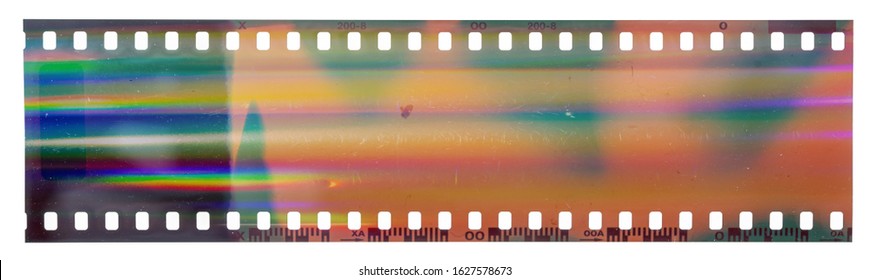 Start of 35mm negative filmstrip, first frame on white background, real scan of film material with cool scanning light interferences on the material.