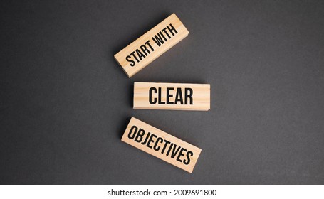 Start With Clear Objectives Word Written On Wood Block. Objective Text On Table, Concept.