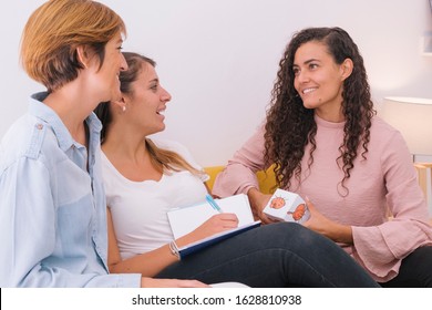 Start Up Company. Group Of Young Social Workers Preparing A Human Emotion Class For Children. Multiethnic People Working Together With Emotions. Female Teacher At Psychology Class For Kids.