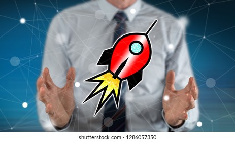 Start up concept between hands of a man in background