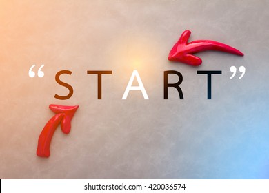 Start Concept With Red Arrow On Grey Leather Background