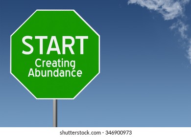 Start Creating Abundance inspirational text on green stop sign with blue sky background and copy space - Shutterstock ID 346900973