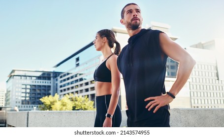 Start Dedicated, Finish Strong. Shot Of A Young Couple Going For A Workout Together In The City.