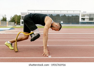 start disabled runner on prosthetic leg on track of stadium - Powered by Shutterstock