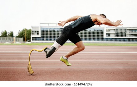 start disabled runner on track. amputee athlete without leg with prosthesis - Powered by Shutterstock