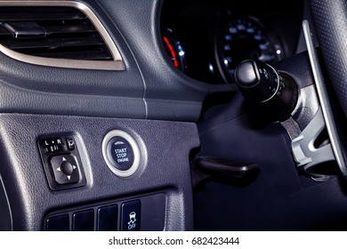 start engine button on the panel near the steering in modern car - Shutterstock ID 682423444