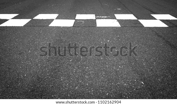 Start and Finish motor race line\
asphalt in circuit, Checkered line on racing motorsport\
track.