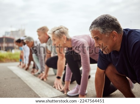 Start, fitness or senior people in a marathon race with running goals in workout or runners exercise. Motivation, focus or healthy group of sports athletes ready for contest on street road in city