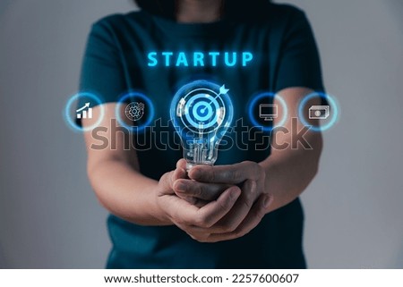 Start up funding, venture capital, businessperson showing hand with investment and technology icons concept to success goal, enterprise, entrepreneurship.