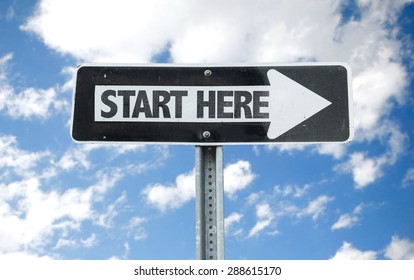 Start Here Direction Sign With Sky Background