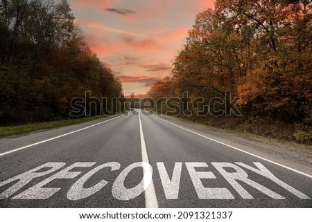 Start to live without alcohol addiction. Word RECOVERY on asphalt highway