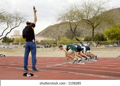 Start Of The Men's 100 Meter Race At A College Track Meet.