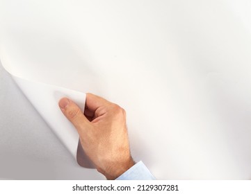 Start a new chapter and turn the page. Cropped shot of an unidentifiable person turning a blank page of copyspace.