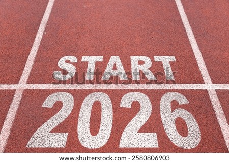 Start of new year. Changes of year 2025, 2026, 2027 on Running track. Concept of new ideas starting in new year, planning along with setting objectives to set KPI goals for success in life.