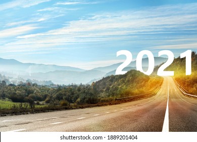 Start new year with fresh vision and ideas. Asphalt road leading to 2021 numbers