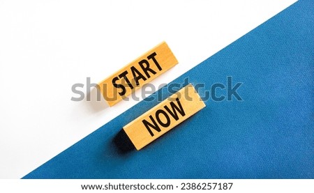 Start now symbol. Concept words Start now on beautiful wooden block. Beautiful white and blue background. Business marketing, motivational start now concept. Copy space.