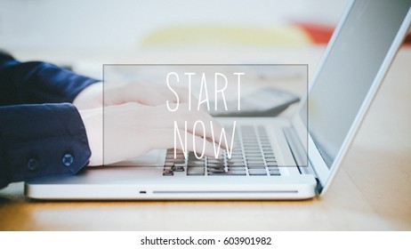 Start Now, text over young business man typing on laptop at desk in office environment