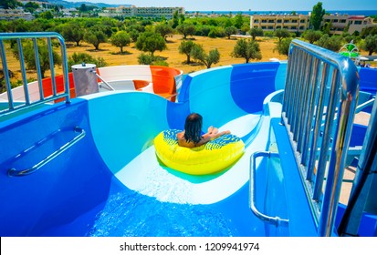 Start Position On The Waterslide, The Lady Ready Just After The Start In The Yellow Downhill Ring, , In The Background Hotel And Sea